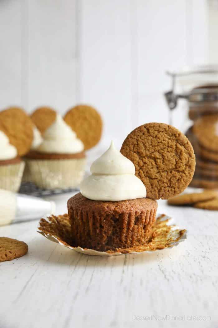 Spiced gingerbread cupcake with cream cheese frosting and a gingersnap cookie on top.