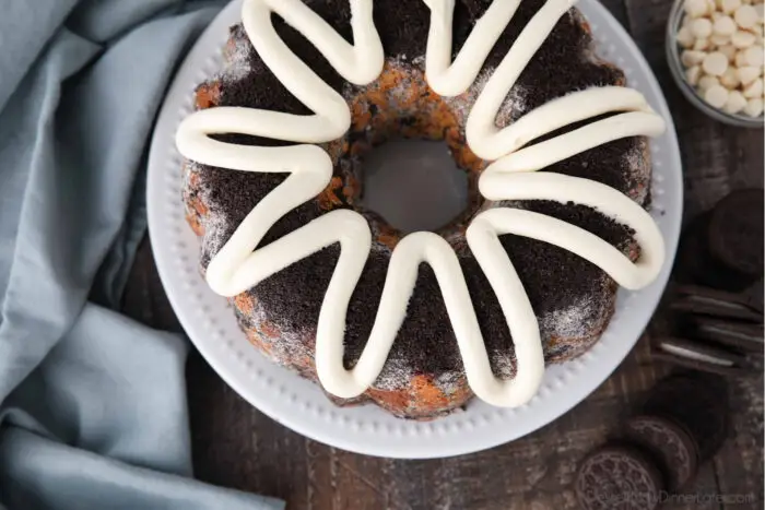 Top view of Cookies and Cream Monkey Bread on a plate with zig-zagged cream cheese frosting on top.