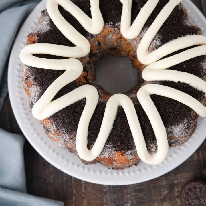 Top view of Cookies and Cream Monkey Bread on a plate with zig-zagged cream cheese frosting on top.