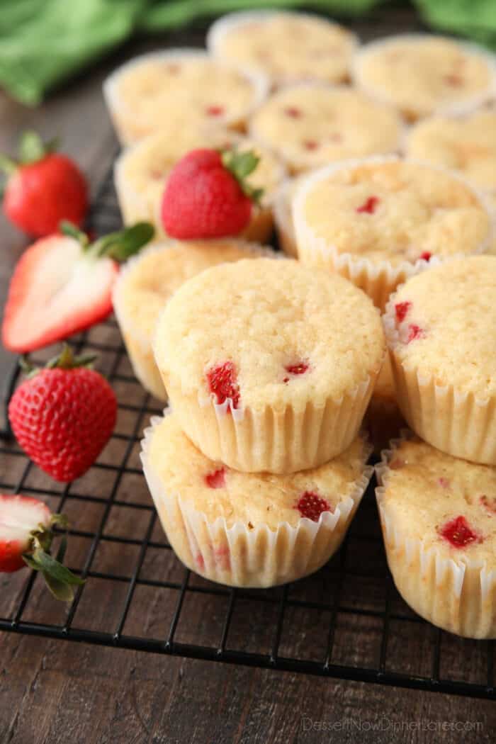 Vanilla cupcakes with chunks of fresh strawberries.