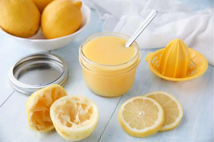 Spoon inside a jar of homemade lemon curd.