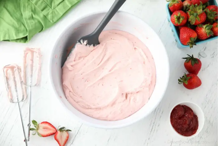 Bowl full of strawberry buttercream frosting.