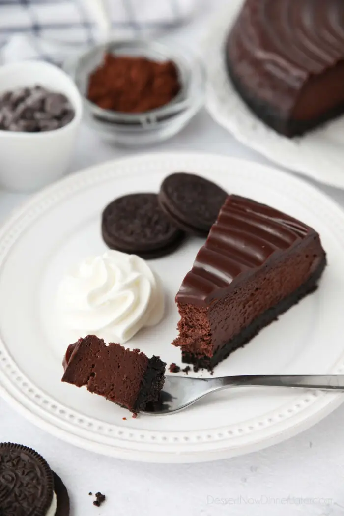 Triple Chocolate Cheesecake on a fork ready to be eaten.