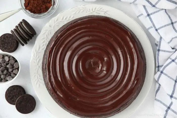 Swirled ganache on top of chocolate cheesecake.