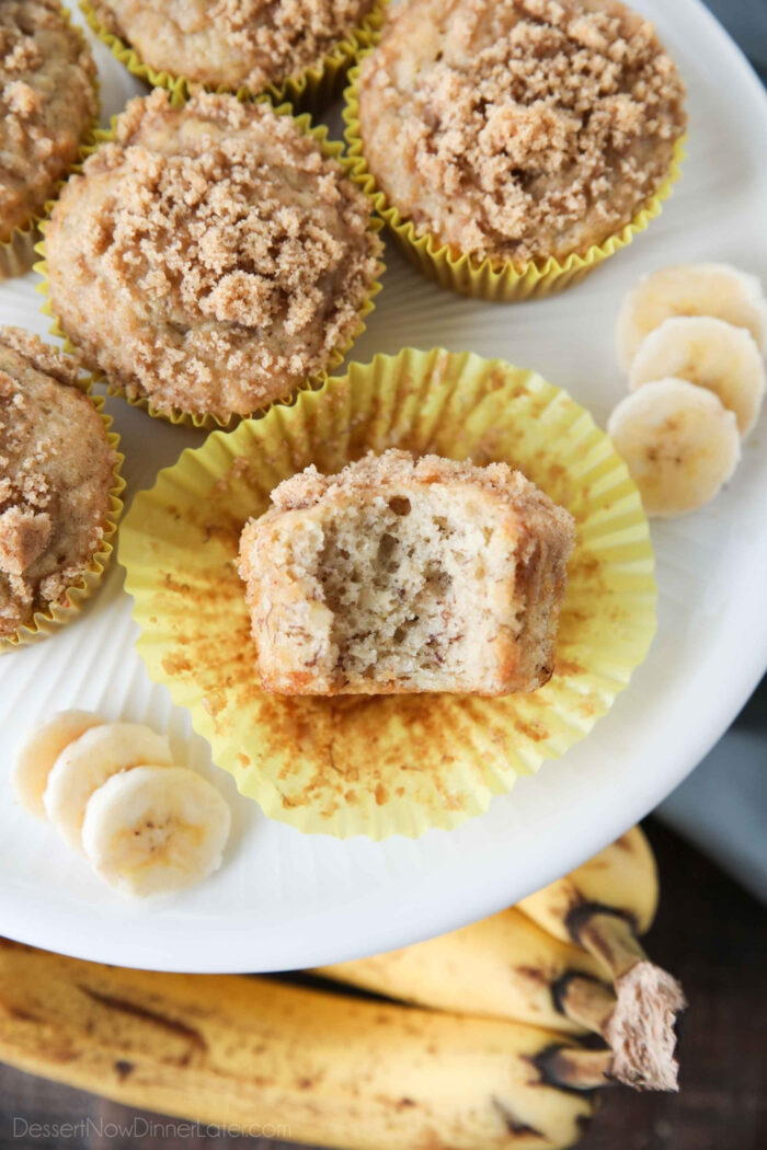 Close up of a banana crumb muffin with a bite taken out.