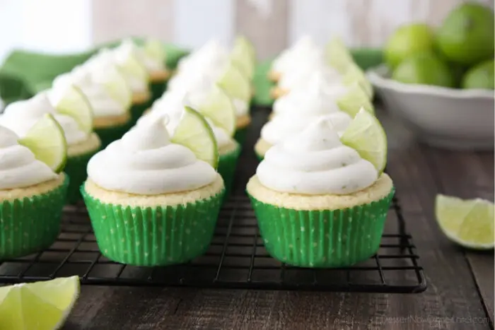 Frosted Key Lime Cupcakes on wire cooling rack.