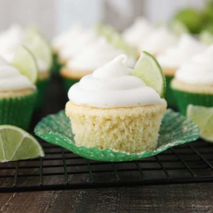 Key lime cupcake on wrapper that has been peeled down on the sides.