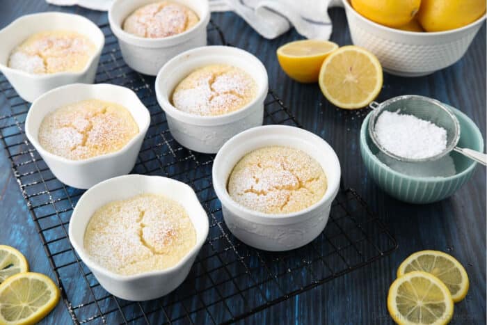 Lemon pudding cakes with powdered sugar sprinkled on top.