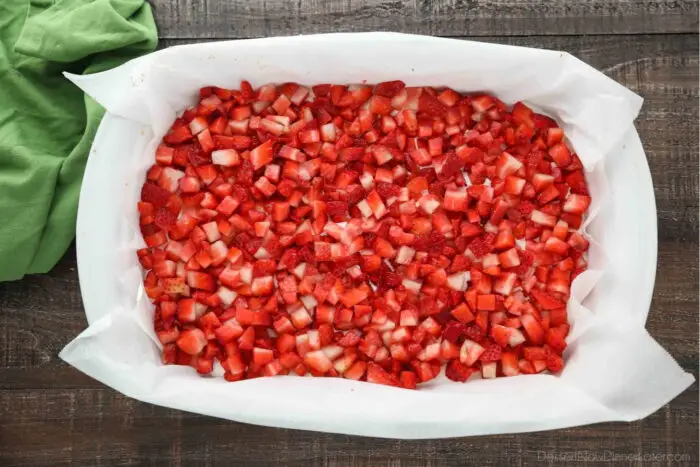 Diced fresh strawberries on top of the no bake cheesecake layer.