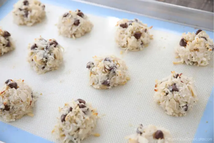 Baked almond joy cookies on a sheet tray.