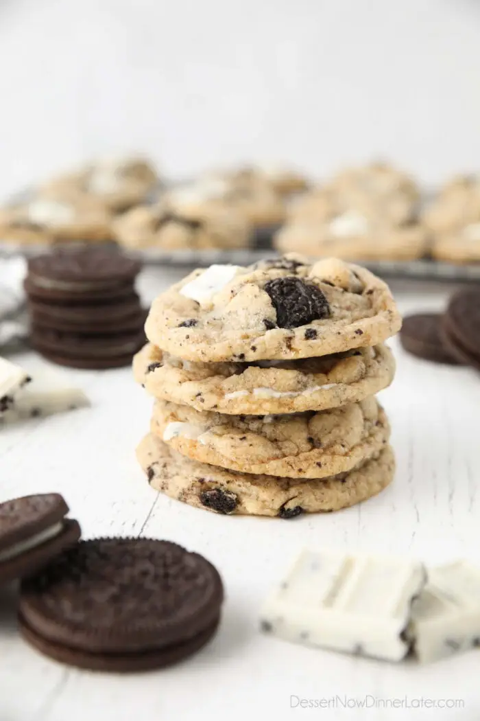 Four cookies and cream cookies stacked on top of each other.