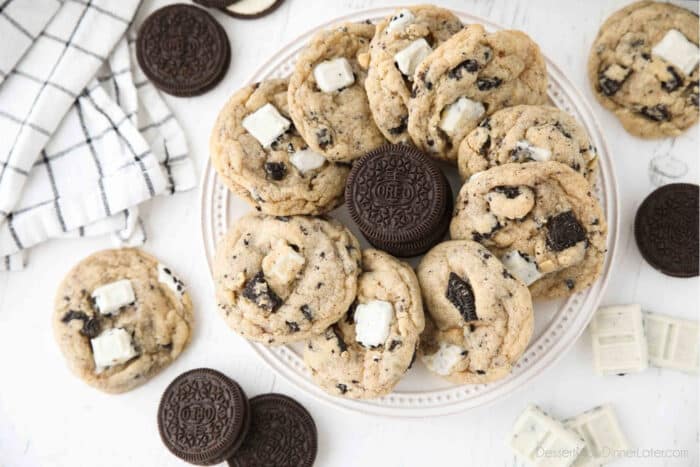 Plate of cookies and cream cookies with a stack of Oreos in the middle.
