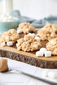 Close up of no-bake rice krispie treat cookies made with white chocolate, peanut butter, and marshmallows.