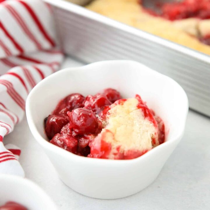 Cherry Cobbler in a bowl made from cherry pie filling and homemade cake batter.