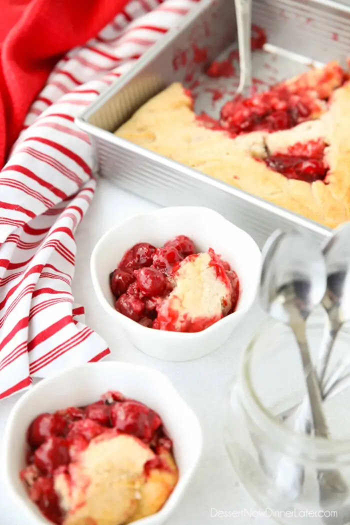 Cherry Cobbler in some bowls and the baking pan.