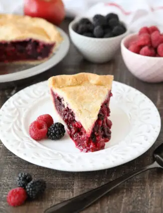 Slice of Razzleberry Pie on a plate. Focusing on the berry pie filling.