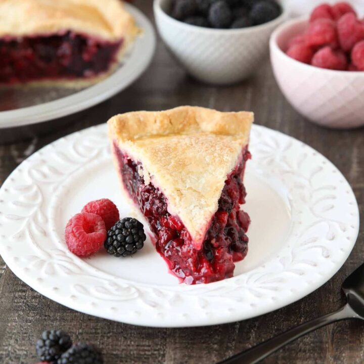 Slice of Razzleberry Pie on a plate. Focusing on the berry pie filling.