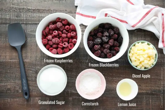Ingredients for Razzleberry Pie - frozen raspberries, frozen blackberries, diced apple, granulated sugar, cornstarch, lemon juice.
