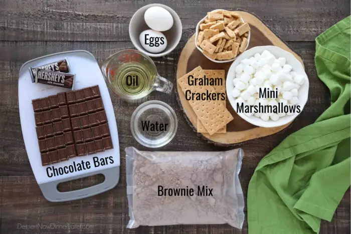 Ingredients for S'mores Brownies: Brownie Mix, Eggs, Oil, Water, Chocolate Bars, Graham Crackers, and Mini Marshmallows.