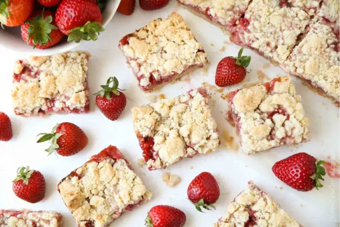Strawberry Crumb Bars dessert squares with fresh strawberries.