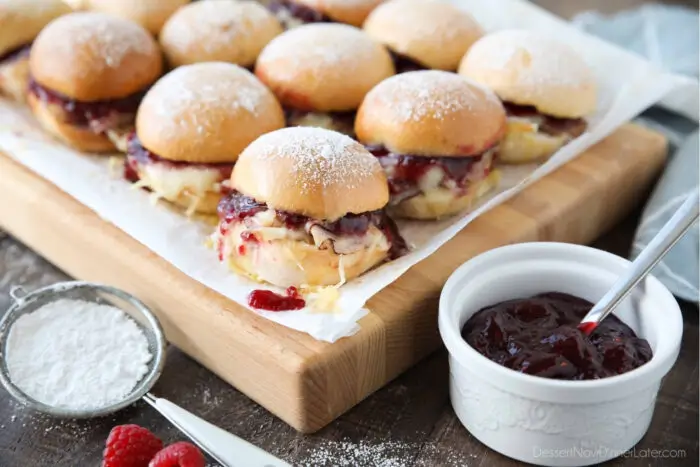 Monte Cristo slider sandwiches with raspberry preserves and powdered sugar.