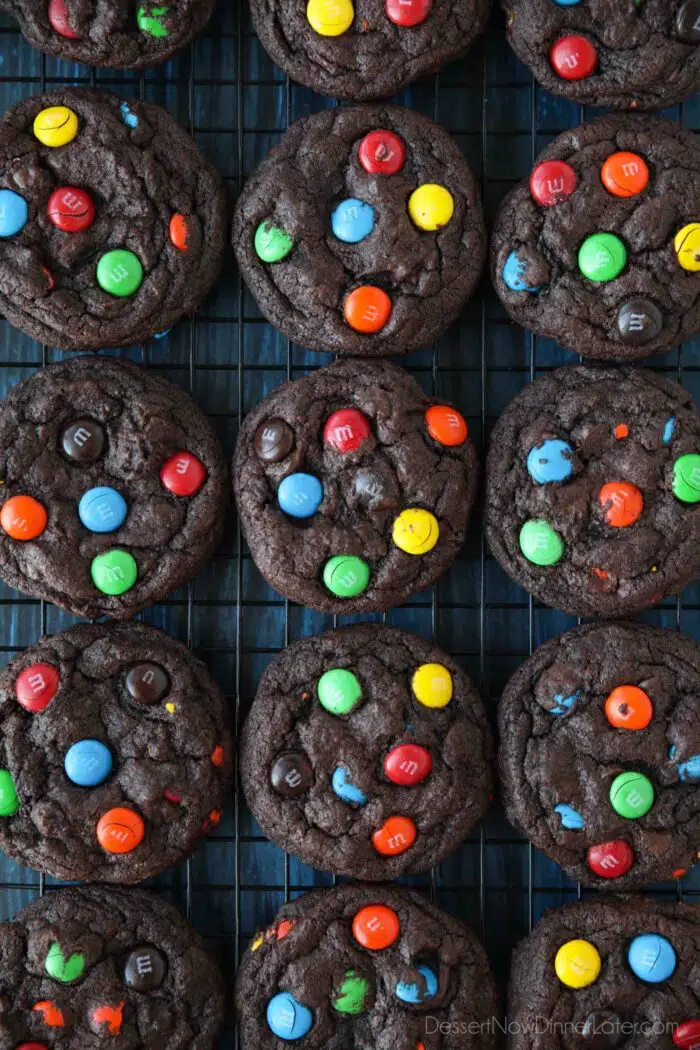 Cooling rack full of chocolate M&M cookies.