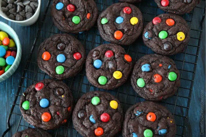 Cooling rack full of chocolate M&M cookies.