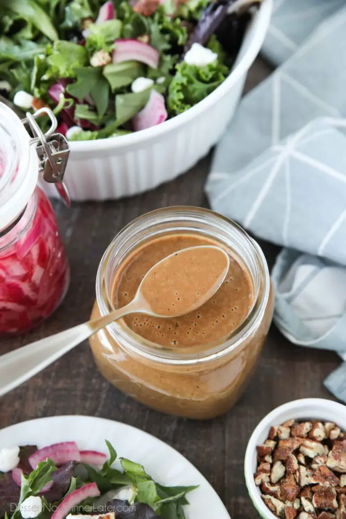 Top view of a spoonful of creamy balsamic dressing.