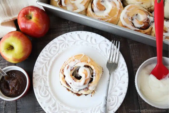 Top view of an apple butter cinnamon roll on a plate.