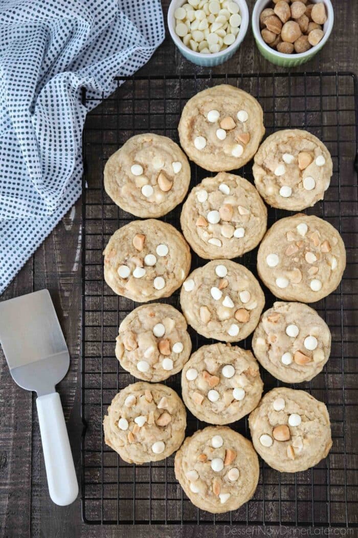White Chocolate Macadamia Nut Cookies on a cooling rack with a spatula on the side.
