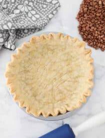 Blind baked pie crust in pan ready for filling.