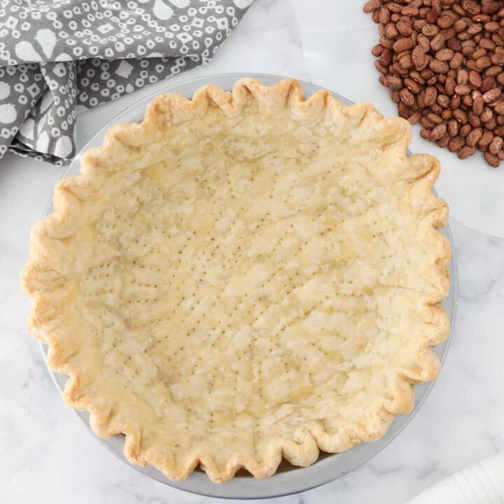 Blind baked pie crust in pan ready for filling.