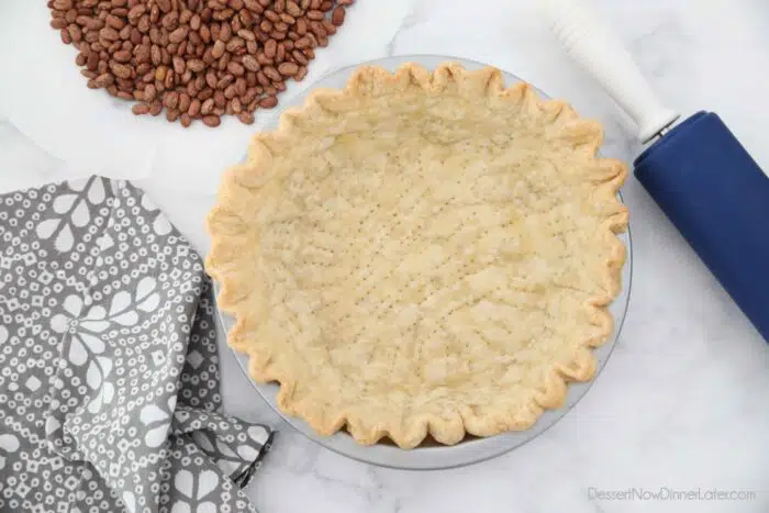 Top view of blind baked pie crust in pan.