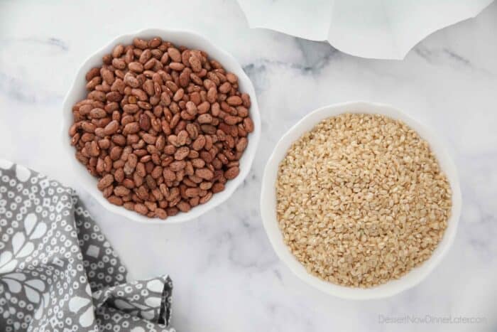 A bowl of dry beans and a bowl of dry rice that can be used for pie weights.
