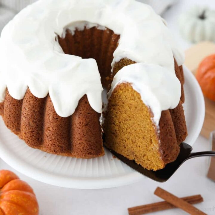 Top view of a slice of pumpkin bundt cake being removed with a cake server.