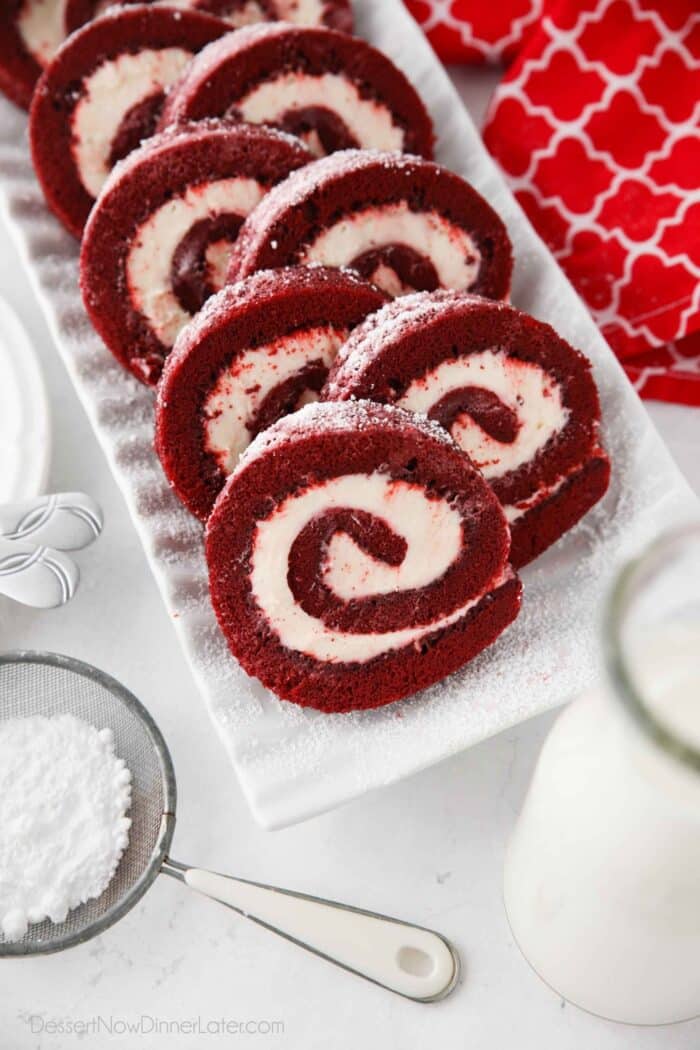 Top view of plated red velvet cake roll slices.
