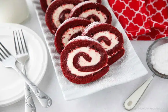 Red Velvet Cake Roulade sliced and on a plate.