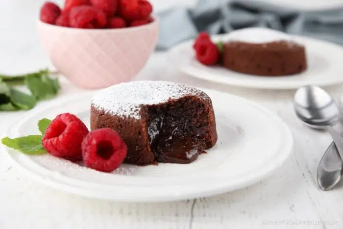 Molten lava cake on plate with gooey center.