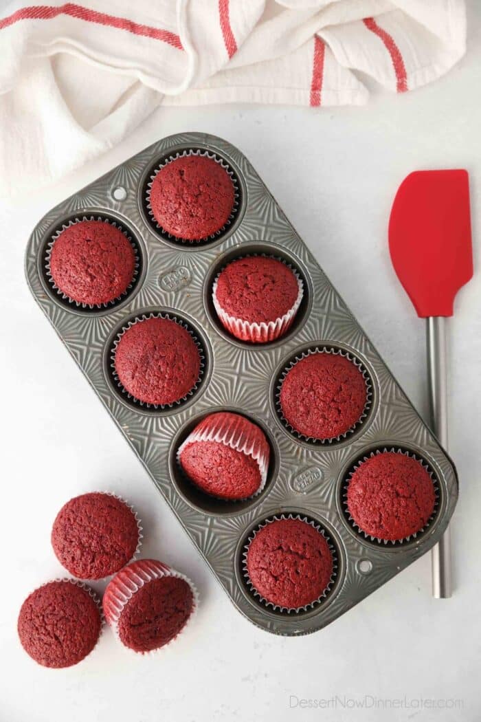 Baked red velvet cupcakes in muffin tin.