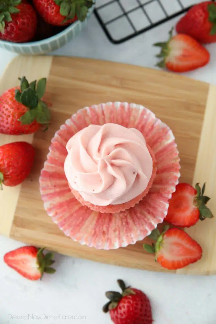 Top view of strawberry cream cheese frosting piped onto the top of a cupcake.