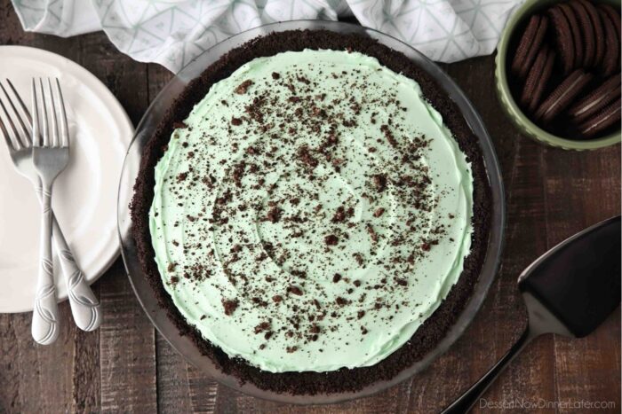 Top view of grasshopper pie in pan with crushed Oreos on top.