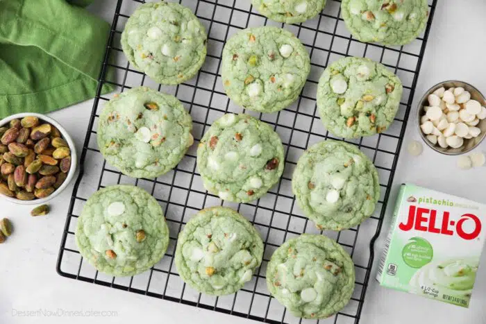 Top view of cooling rack with pistachio pudding cookies.