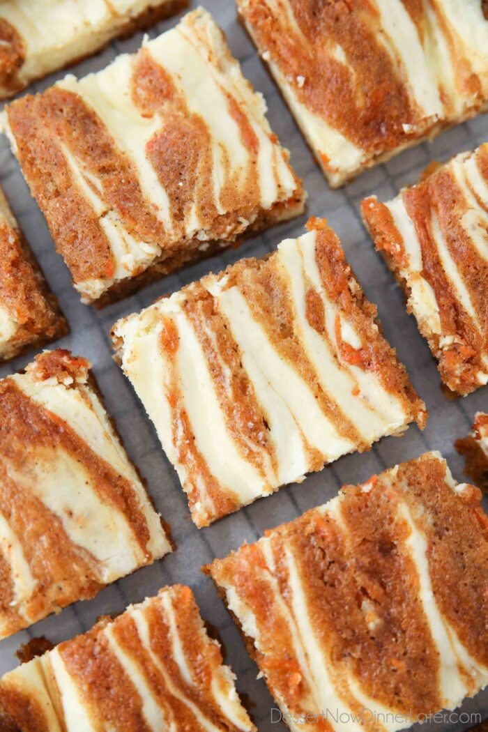 Close-up top view of Carrot Cake Blondies. Swirled dessert bars with carrot cake and cheesecake baked together.