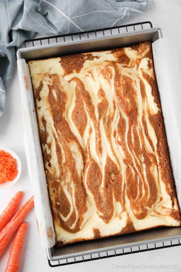 Pan of swirled carrot cake and cheesecake baked together.