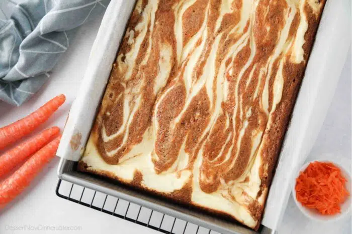 Pan of Carrot Cake Brownies swirled with cream cheese.