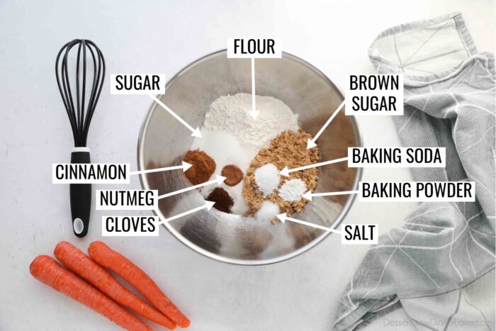 Bowl of labeled dry ingredients for Carrot Cake Cheesecake Bars.