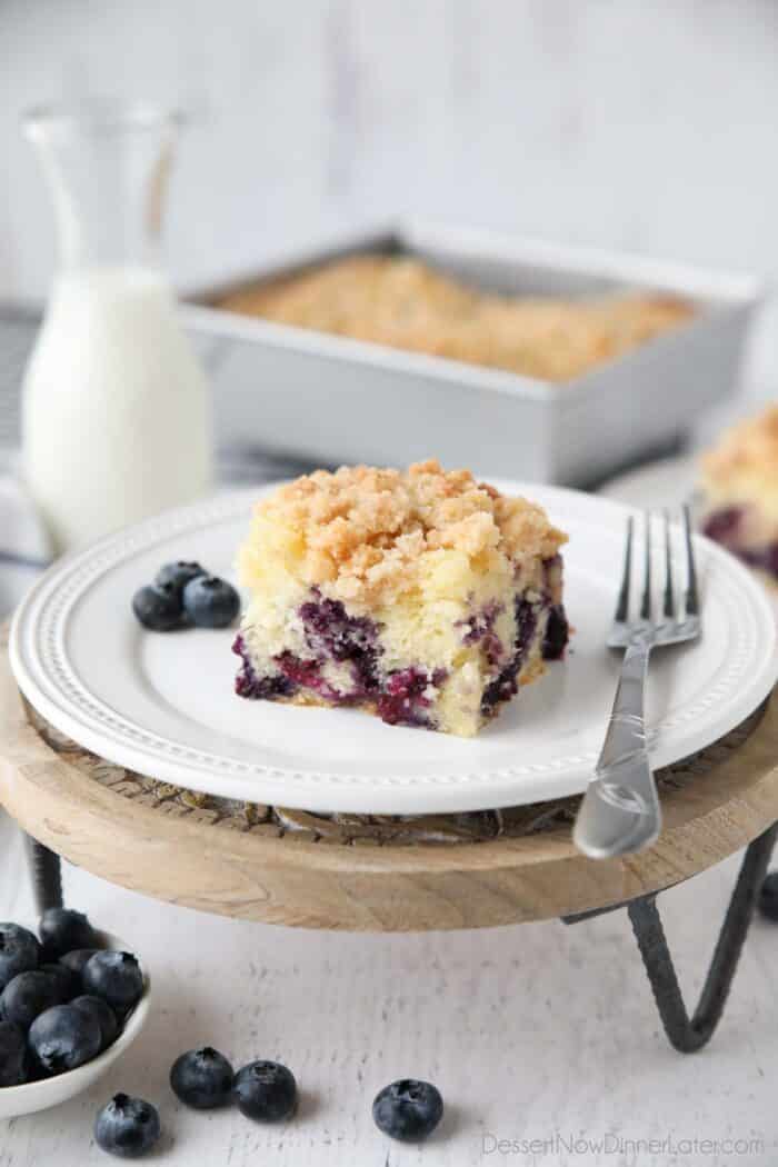 Slice of Blueberry Crumb Cake on a plate with a fork.