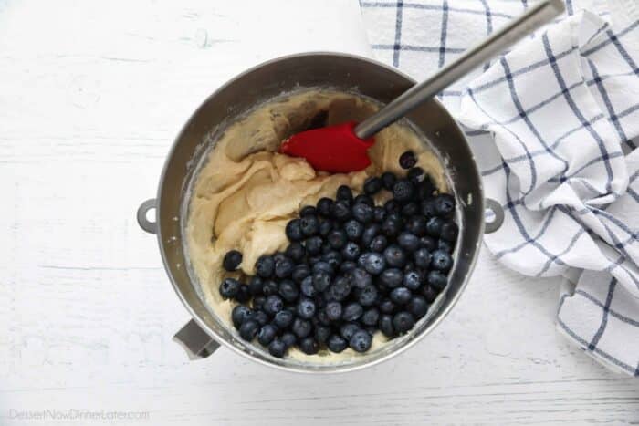 Blueberries being added to cake batter.