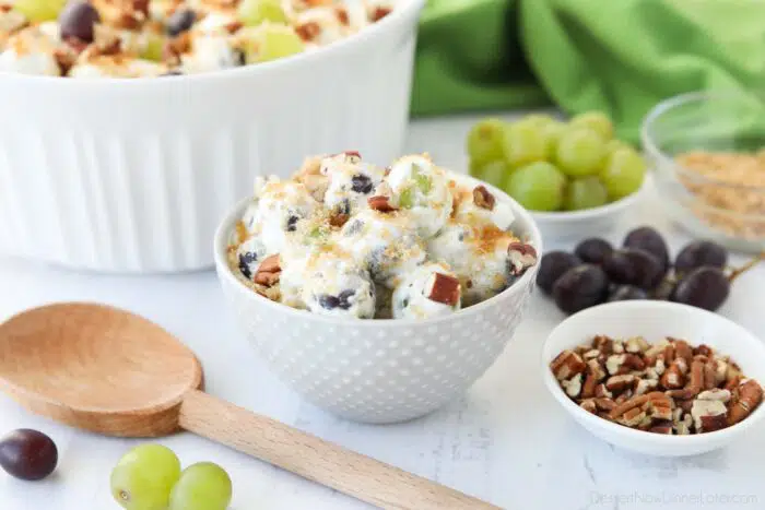 Individual serving of creamy grape salad in a bowl.