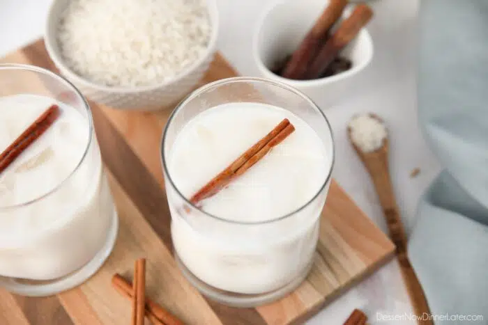 Close-up top view of creamy horchata in a glass cup.